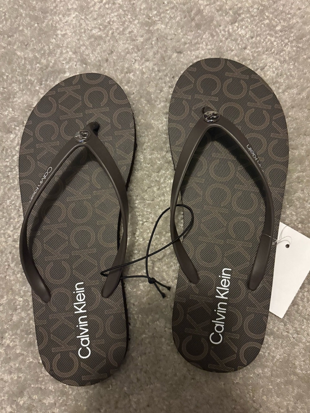 BNWT women’s CK brown flip flops
